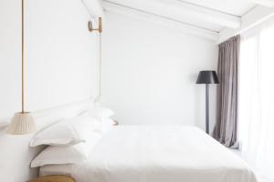 Postel nebo postele na pokoji v ubytování Senato Hotel Milano