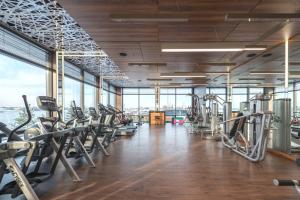 a gym with treadmills and elliptical machines at Orbi City Premium Apartments in Batumi