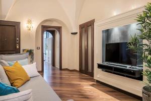 a living room with a large flat screen tv at Alassio Vayadu' Arabesque in Alassio