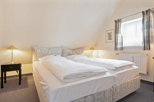 Ein Bett oder Betten in einem Zimmer der Unterkunft Friesenhörn, App. 4 links