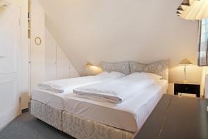 Ein Bett oder Betten in einem Zimmer der Unterkunft Friesenhörn, App. 4 links
