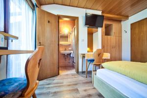 Postel nebo postele na pokoji v ubytování Gasthof Anny + 21 fotografií
