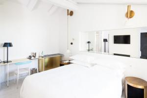 Postel nebo postele na pokoji v ubytování Senato Hotel Milano