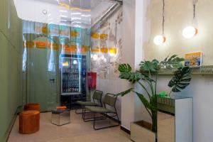 a waiting room with chairs and a drink machine at Cabins Sleeping Mets in Athens