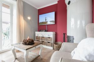 TV a/nebo společenská místnost v ubytování Strand Hues