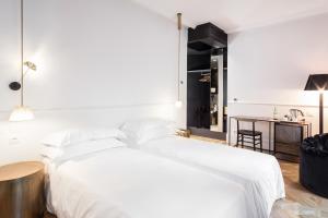 Postel nebo postele na pokoji v ubytování Senato Hotel Milano