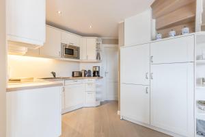Kuchyň nebo kuchyňský kout v ubytování Strandresidenz Wohnung Langeness