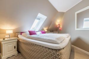 Postel nebo postele na pokoji v ubytování Strandresidenz Wohnung Langeness