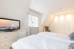Ein Bett oder Betten in einem Zimmer der Unterkunft Haus Seaside