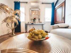a bowl of fruit on a table in a living room at LE MURANO LUXURY LAGOON in Murano