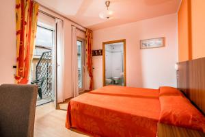 Postel nebo postele na pokoji v ubytování Hotel Vienna