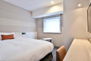 Katil atau katil-katil dalam bilik di Vessel Inn Chiba Station