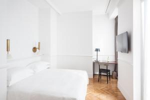 Postel nebo postele na pokoji v ubytování Senato Hotel Milano