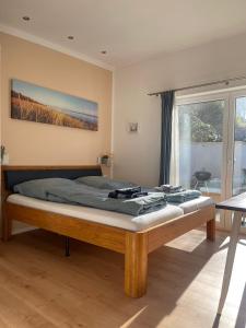 a large bed in a room with at Klein aber Fein mitten in Binz in Binz