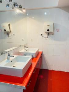 a bathroom with two sinks and a red counter at Transit 77 in Istanbul