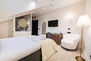 Posteľ alebo postele v izbe v ubytovaní Hotel Bohemian Garni - Skadarlija