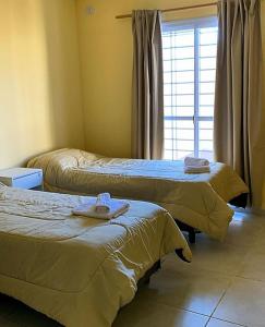 Una cama o camas en una habitación de La vecindad San Rafael