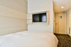 Katil atau katil-katil dalam bilik di Vessel Inn Chiba Station