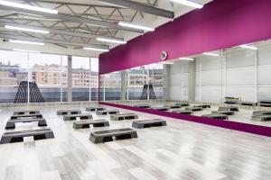 a room with rows of benches in a building at Mirax Boutique Hotel in Kharkiv