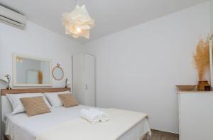 Postel nebo postele na pokoji v ubytování Holiday Home Nona