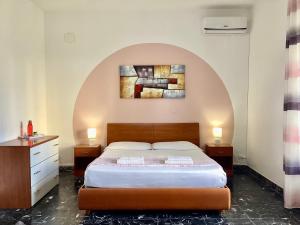 Postel nebo postele na pokoji v ubytování Gardenia Rooms