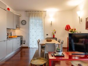 a kitchen and a dining room with a table and a dining room at Apartment Isola delle Abbadesse by Interhome in Milan