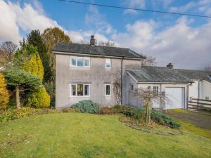 a large white house with a yard at 3 Bed in Threlkeld SZ047 in Threlkeld