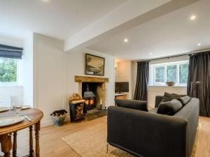 a living room with a couch and a fireplace at 1 bed property in Tetbury 87442 