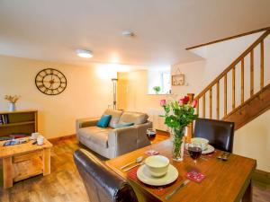 a living room with a table and a couch at 1 bed property in Bala 89368 in Llandderfel