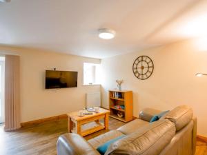 a living room with a couch and a table at 1 bed property in Bala 89368 in Llandderfel