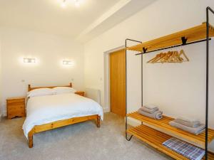 a bedroom with a bed and a mirror at 2 Bed in Askam - in - Furness 88651 in Ireleth