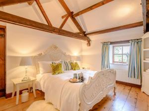 a bedroom with a white bed and a window at 2 bed in Ramsgill 89165 in Bouthwaite
