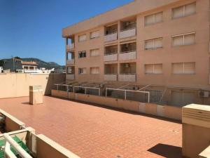 a building with balconies on the side of it at Apartamento Miami Playa, 2 dormitorios, 4 personas - ES-9-152 in Hospitalet de l'Infant