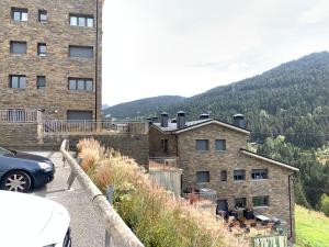 a building with a car parked in front of it at NORDIC LAIA 4B - Soldeu - Bordes d'Envalira in Bordes d´Envalira 