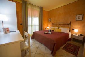 Postel nebo postele na pokoji v ubytování L'Antica Sosta + 24 fotografií