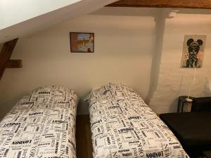 a bed in a corner of a room at ATTIC FLOOR in Stockholm City! 918 in Stockholm