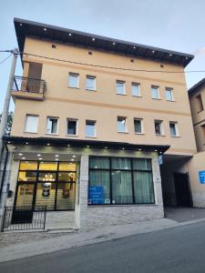 a large building with windows on the side of it at Hotel Nacional Free Parking in Sarajevo