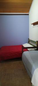 Cama o camas de una habitación en casas temporada em Tiradentes do mazinho