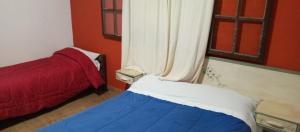Cama o camas de una habitación en casas temporada em Tiradentes do mazinho