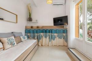 TV a/nebo společenská místnost v ubytování Appartement Pinède