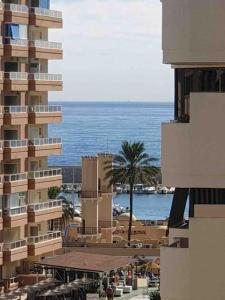 a view of a building with the ocean in the background at Superb Penthouse in Central Fuengirola in Fuengirola