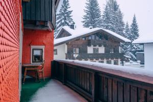 a balcony of a house with snow on the roof at Haus Richard Falch in Sankt Anton am Arlberg