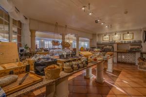 a large kitchen with a long counter with food on it at Charming Residence & Guest House Dom Manuel I Adults only in Lagos