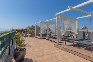 a patio with chairs on a roof at Charming Residence & Guest House Dom Manuel I Adults only in Lagos