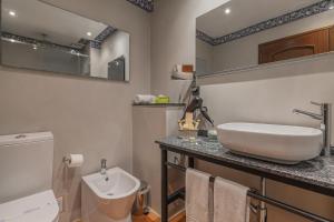 a bathroom with a sink and a toilet at Charming Residence & Guest House Dom Manuel I Adults only in Lagos