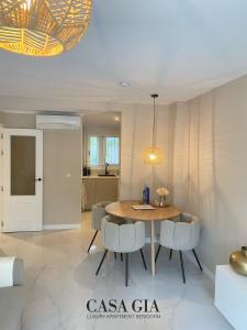 a dining room with a table and chairs at CASA GIA l Luxury apartment Benidorm in Benidorm