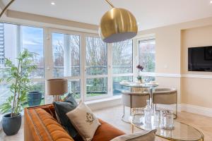 a living room with a couch and a table at Flat 205 in London