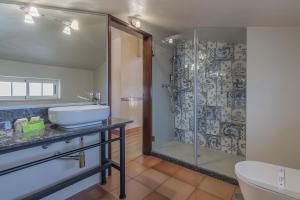 a bathroom with a sink and a shower at Charming Residence & Guest House Dom Manuel I Adults only in Lagos