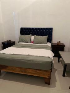 Postel nebo postele na pokoji v ubytování YAMASÁ SHARED VILLa
