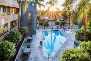 an overhead view of a swimming pool in a building at Travelodge by Wyndham Commerce Los Angeles Area in Commerce